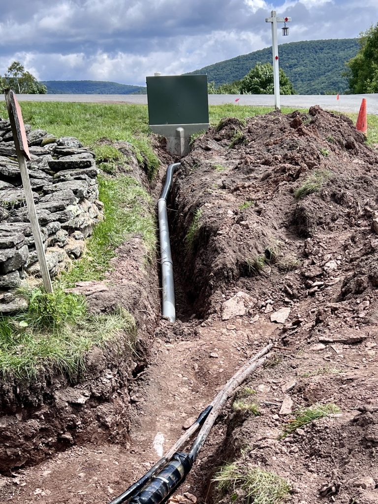 New trench and wiring adjacent to the guard house on Scudder Hill Rd