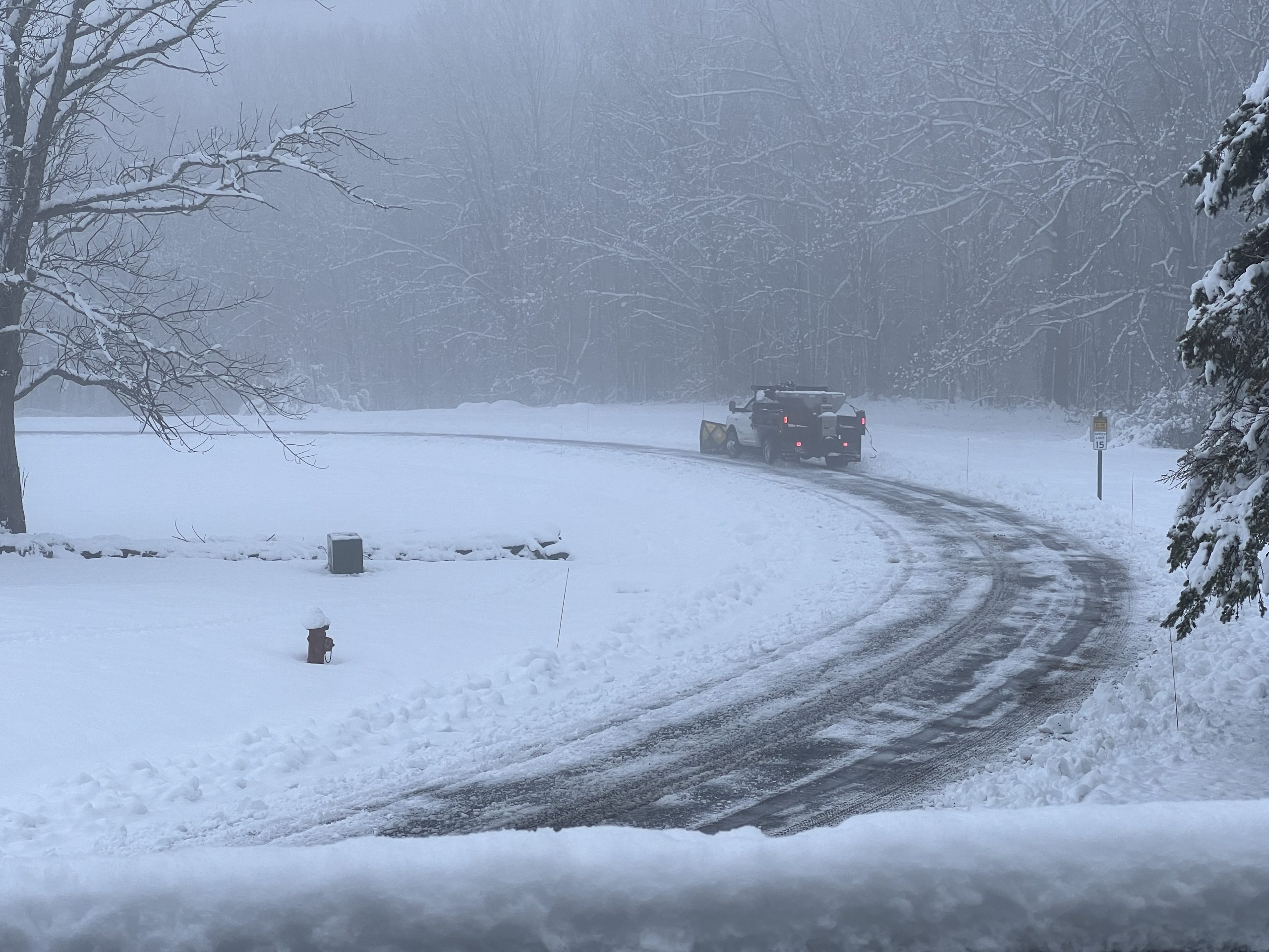 Plow clearing snow on Woodland Dr. on Thanksgiving Day, 2024